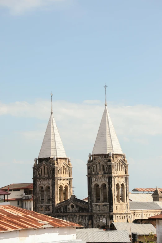 a city skyline with two clocks tower on top