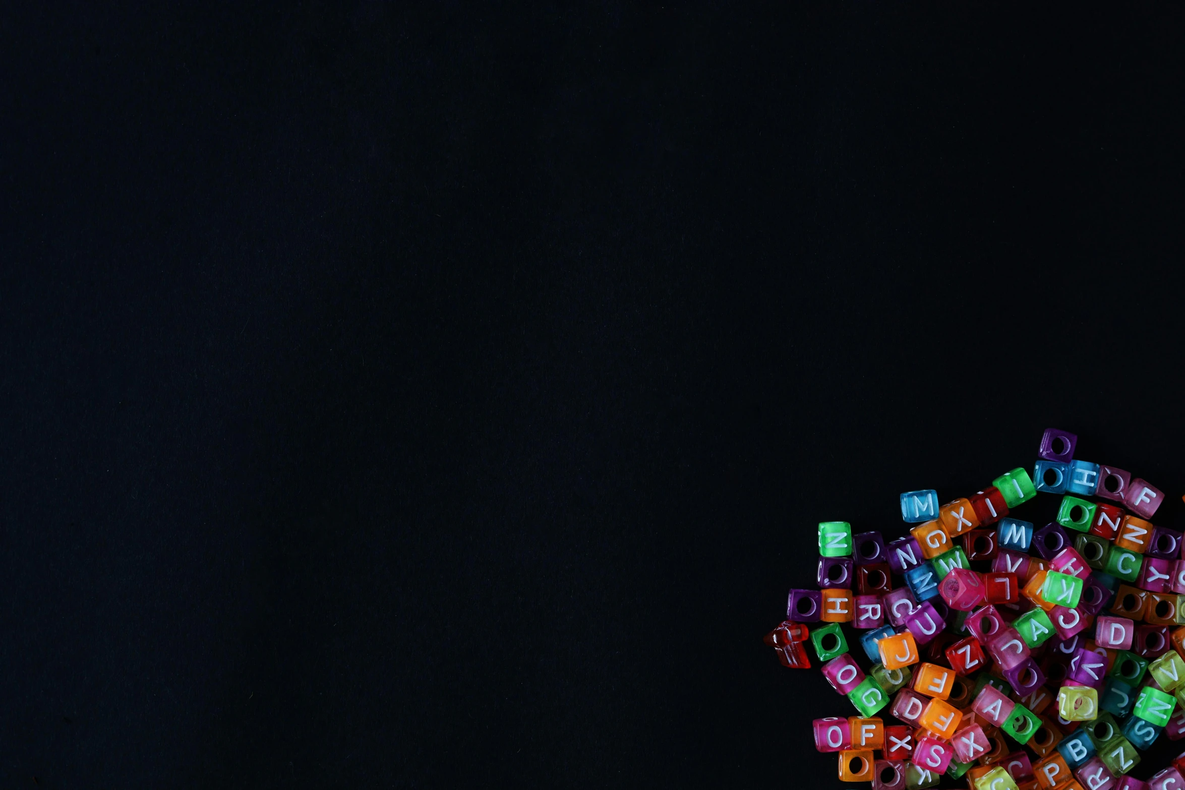 many colored dice sit together in a row