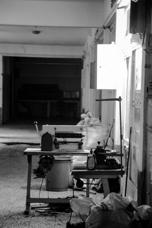 an open garage with work bench and light