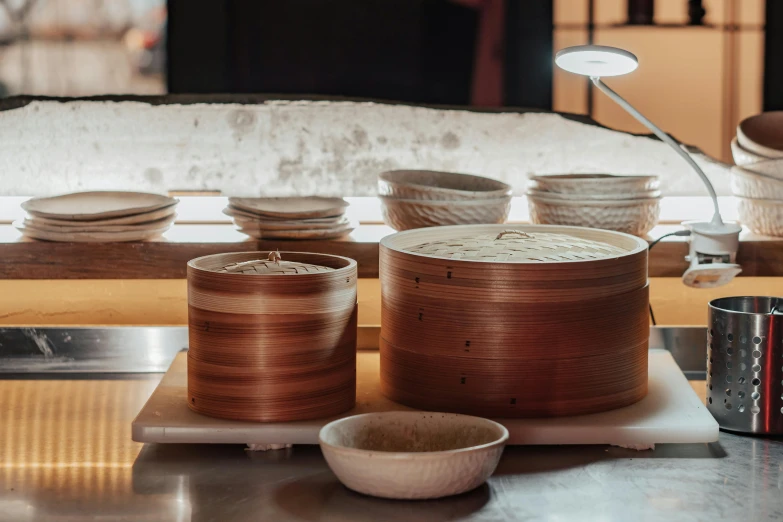 many bowls on a counter that include bamboo