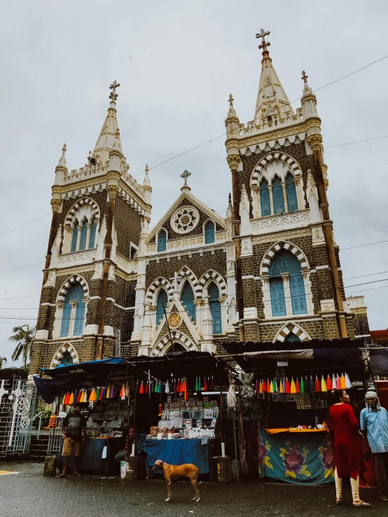 some people are standing near a market