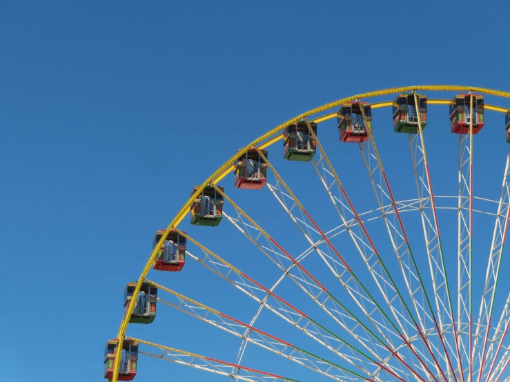 a carnival ferris wheel that has people on it