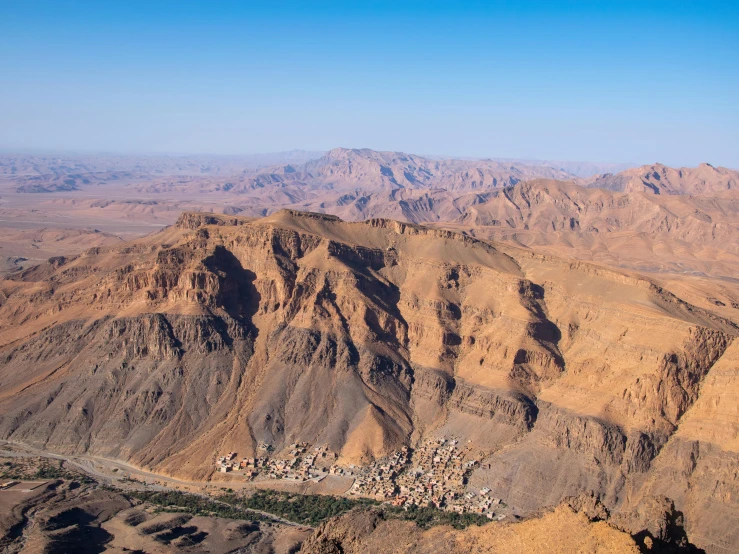 a city surrounded by mountains in the desert