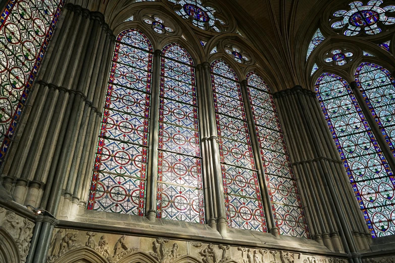 a large cathedral window with two beautiful stained glass panels