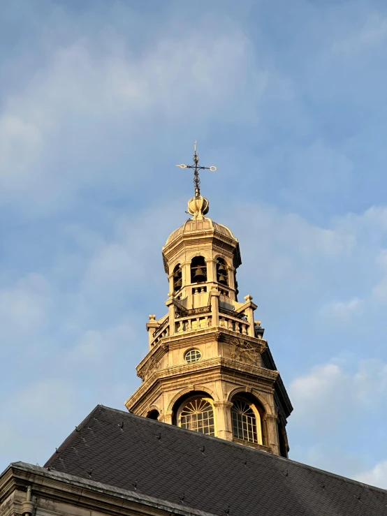 the top of a building with a cross on top