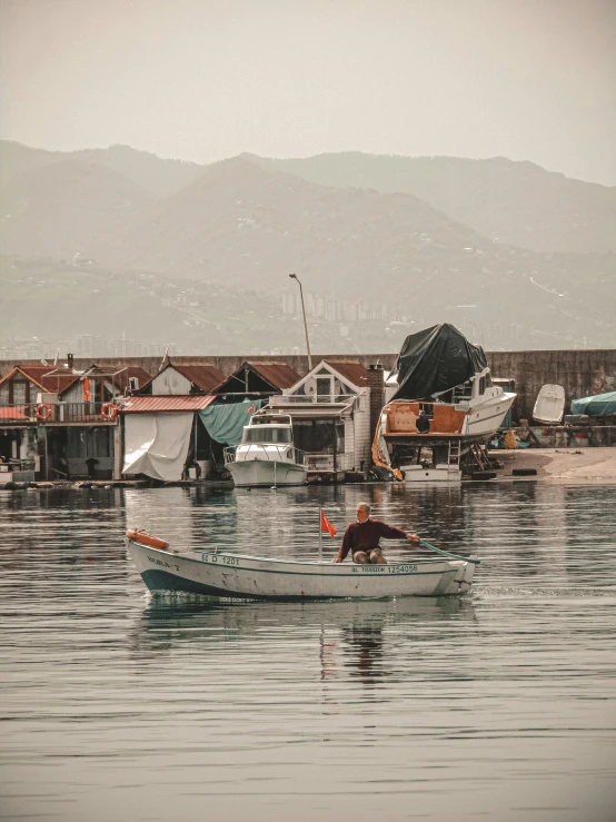 there are boats and one boat is tied up in the water