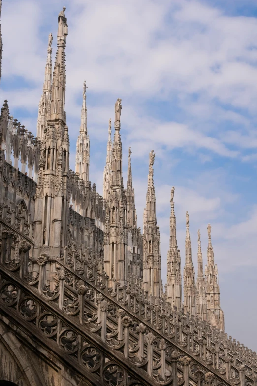 the spires on the building are made of stone