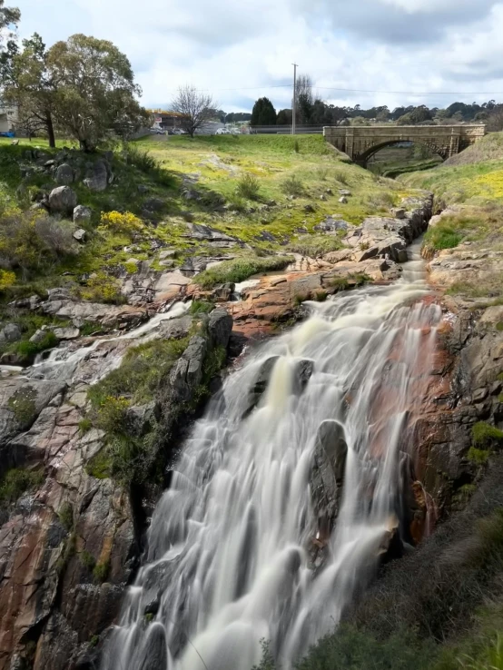 an image of a beautiful waterfall in the countryside