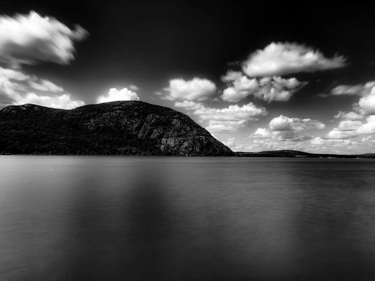 an image of a mountain in the water