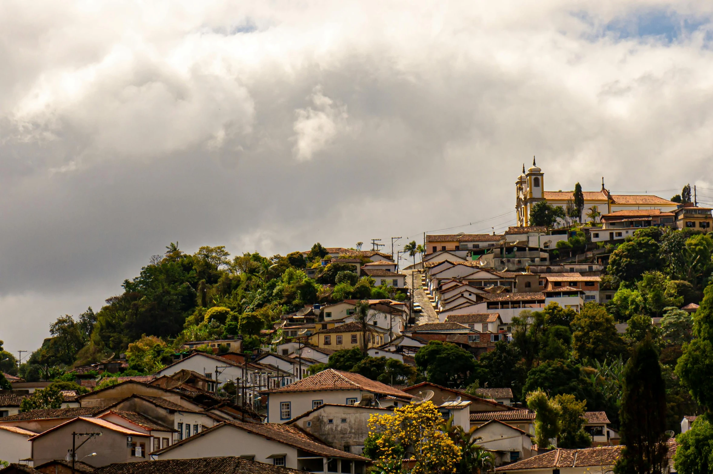 there are houses that are perched on top of the hills