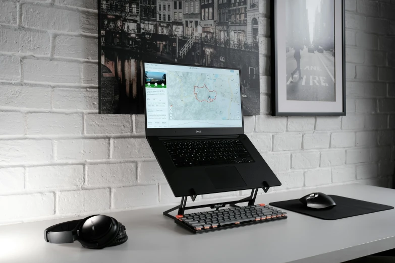 a laptop computer sitting on top of a desk