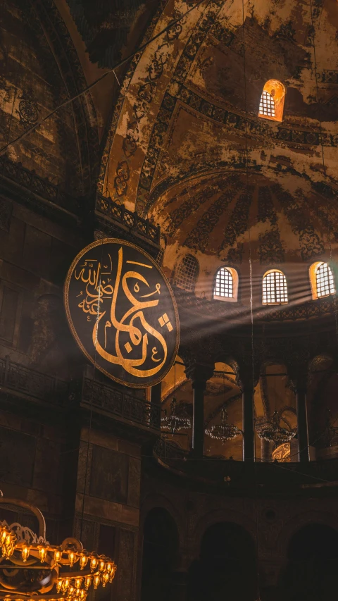 an ornate interior of a building with stained glass windows and arabic decorations