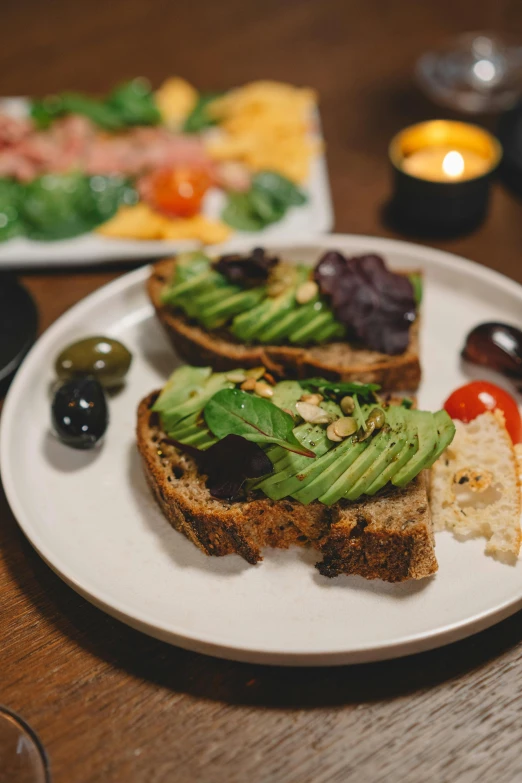 bread and green veggies on a plate