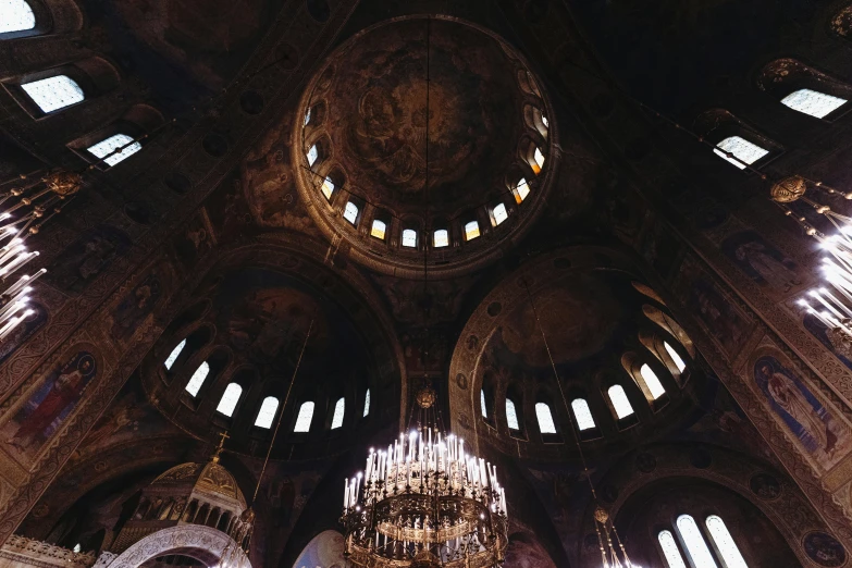 an ornate ceiling in a church with chandeliers