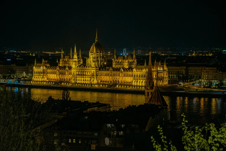 the illuminated castle is at night in europe