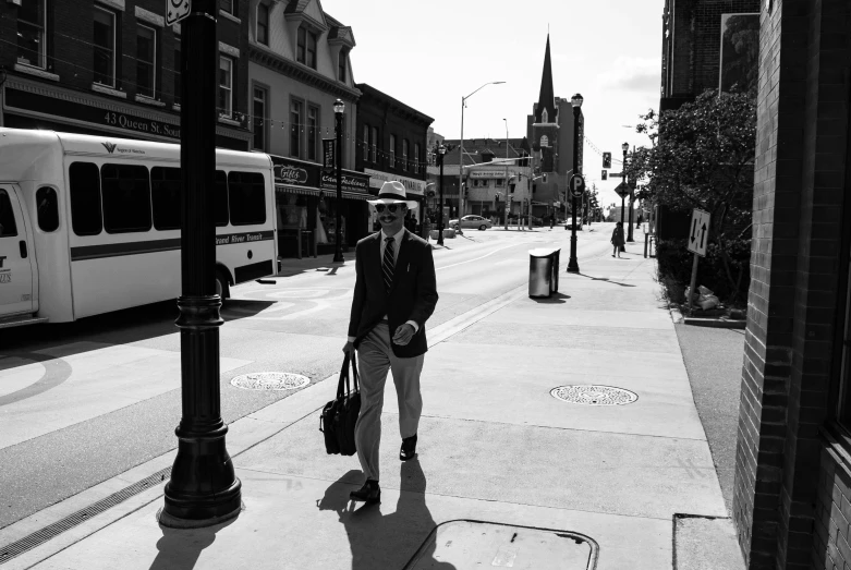 a person that is standing on the side of a road