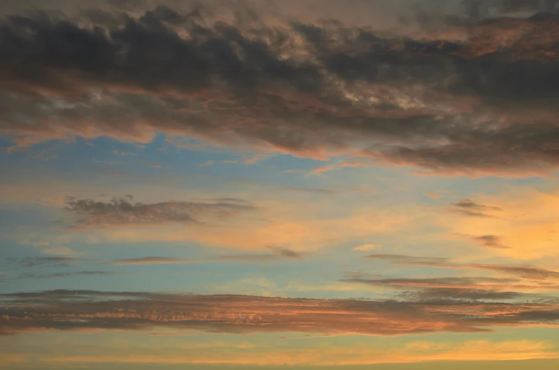 a beautiful sunset with colorful clouds and a blue sky