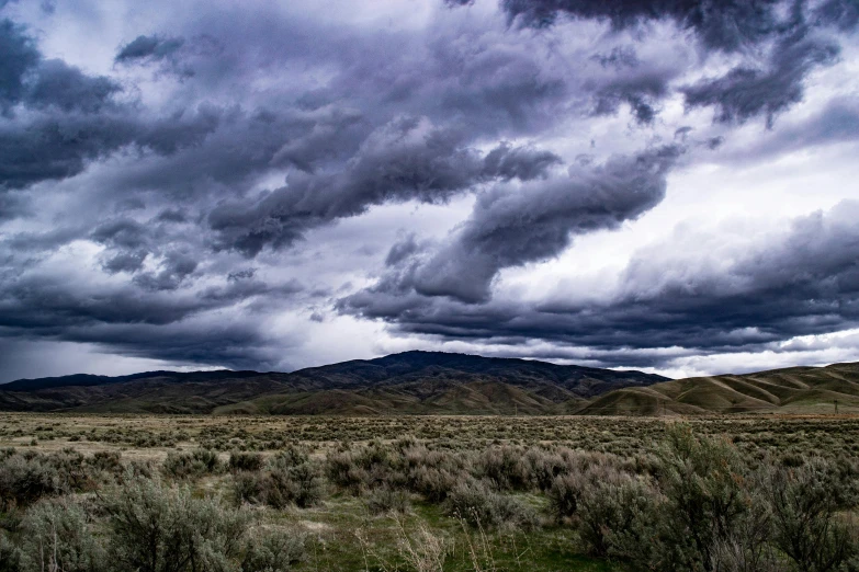 a dark and stormy sky over the desert