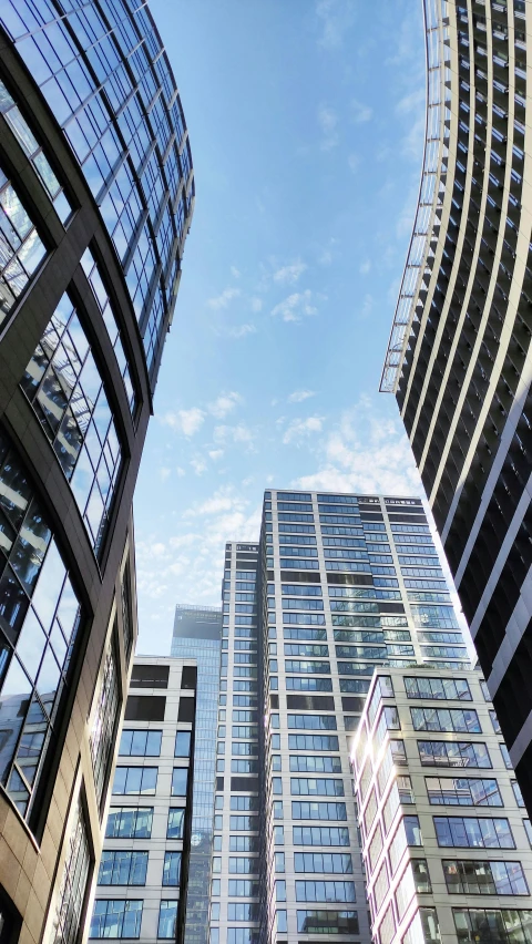 some tall buildings with lots of windows next to each other