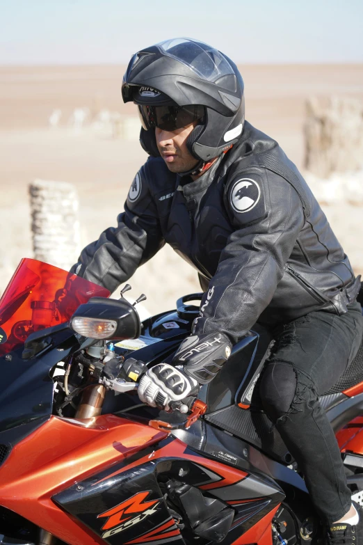 a man is riding on the back of a motorcycle