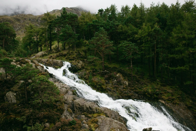 a waterfall with lots of water flowing over it