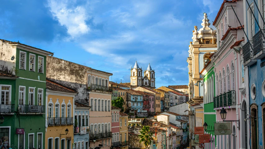 buildings with white spires and green and yellow windows