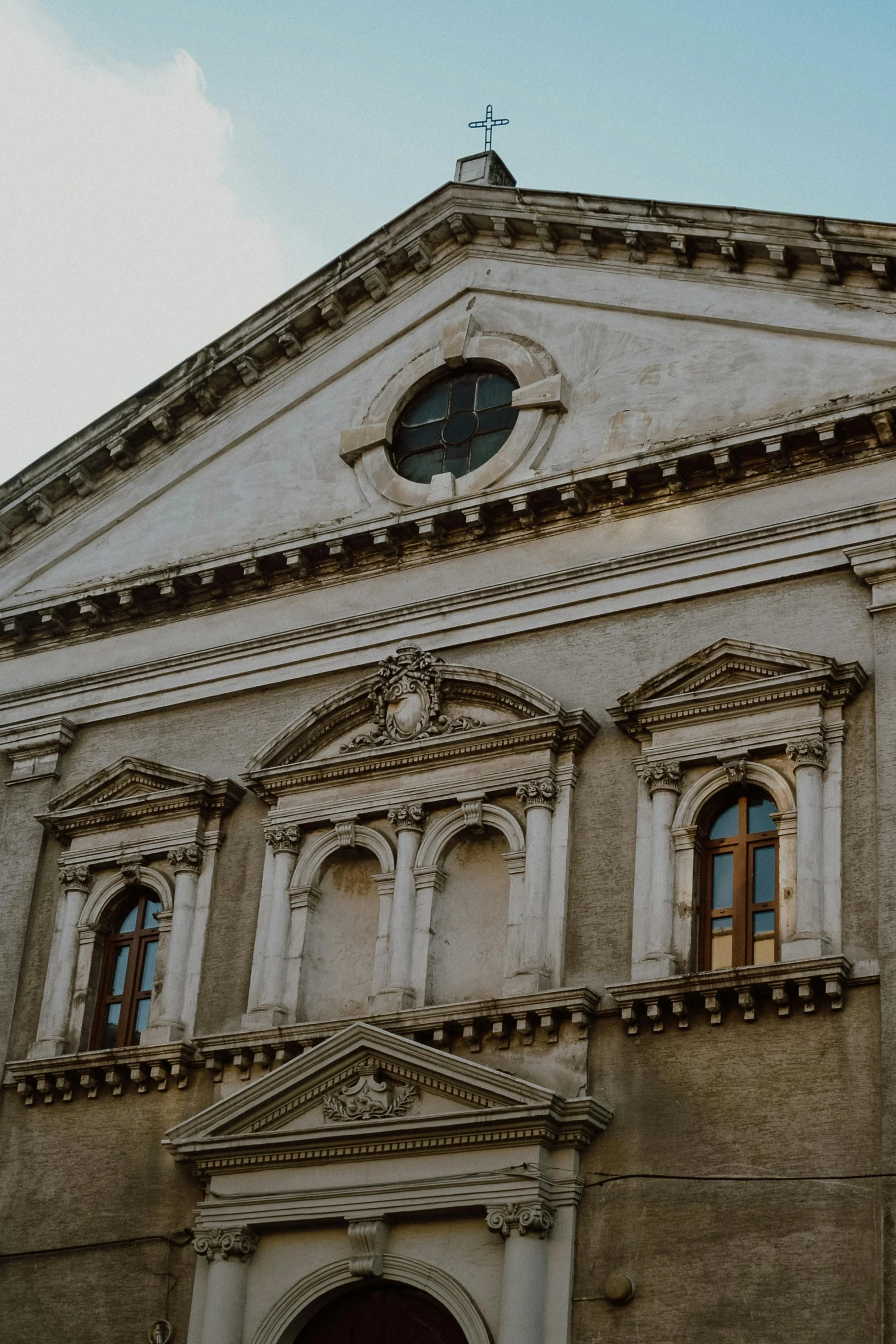 an old building with a clock on the outside