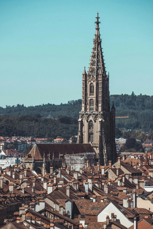 a very tall church on top of a city