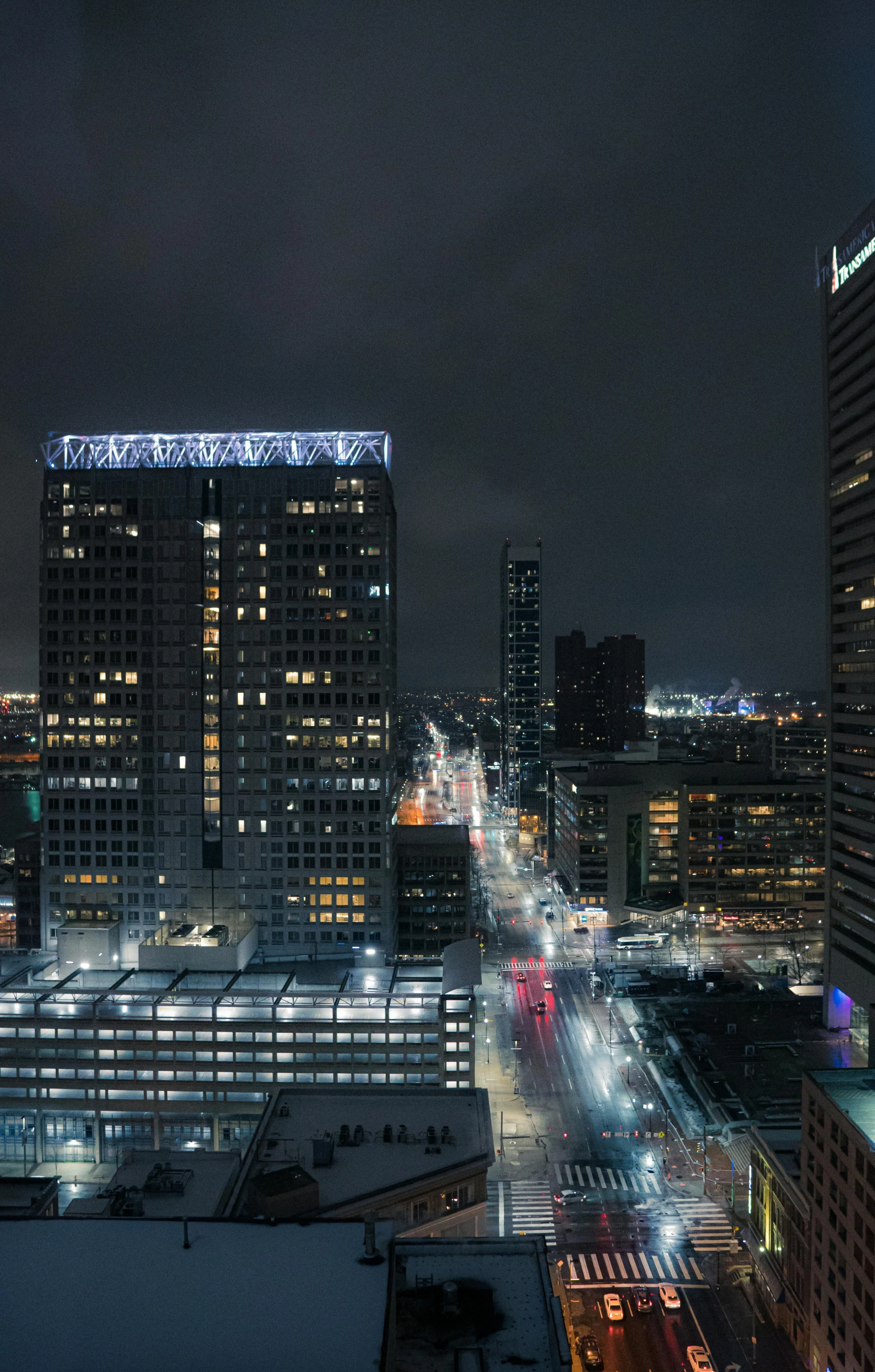 a city at night with a lot of tall buildings