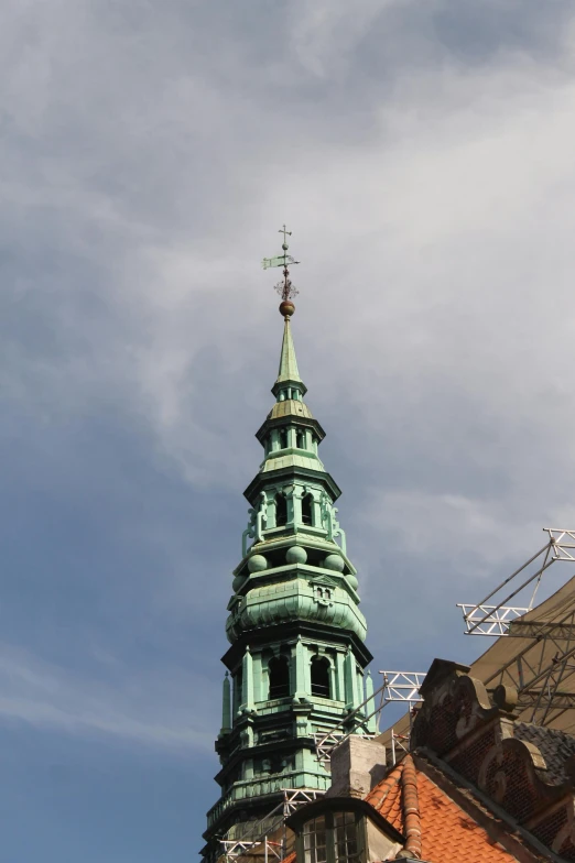 a building with a steeple and many windows