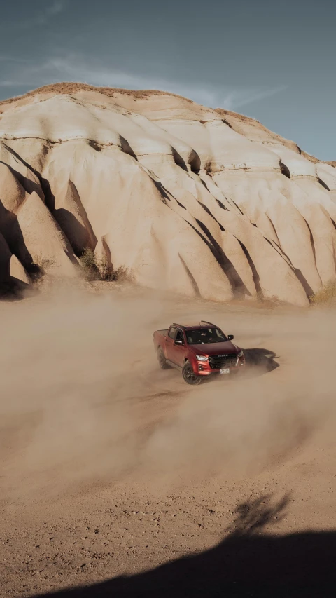 the jeep is driving on sand and dirt trail