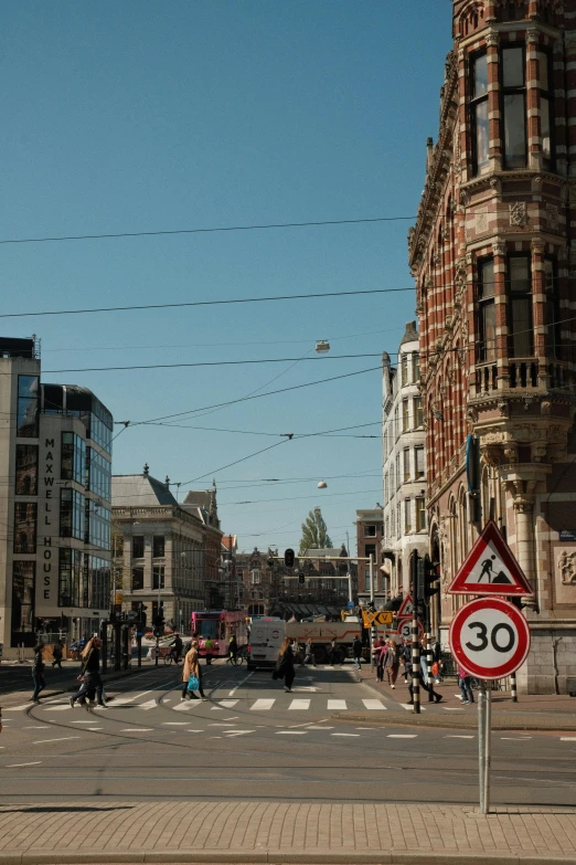 a road in an urban setting with many kites flying overhead