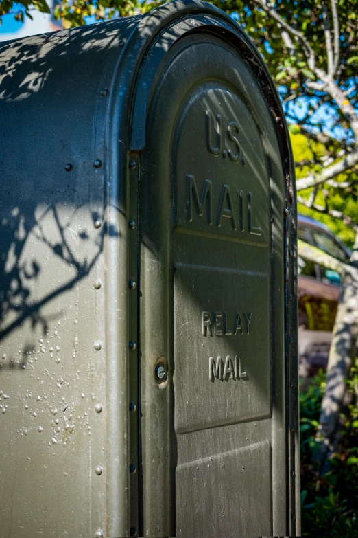 the mailbox is decorated and has a number on it