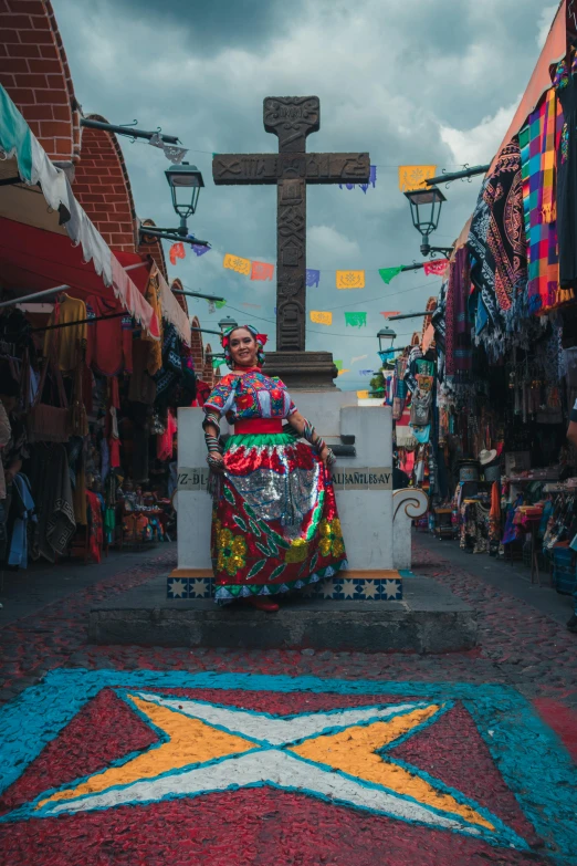 the sculpture is decorated with an image of a woman and cross on it