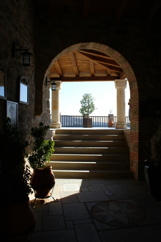 a long stone staircase leading to a large patio