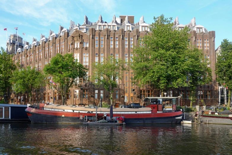 an old boat is docked on the river