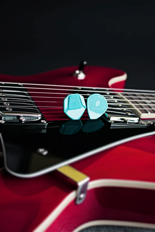 a pair of blue and black guitar ons with guitar notes