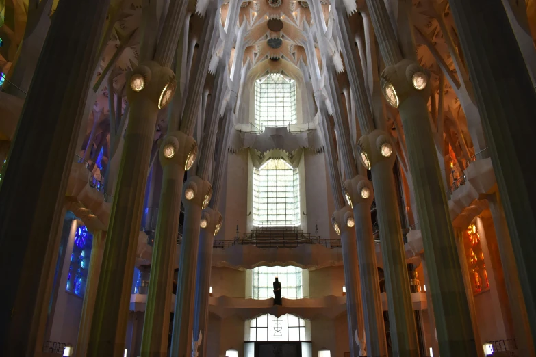 looking up into a very large cathedral of stone columns and windows