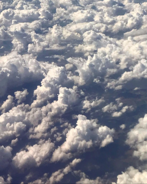 there is a view from an airplane window of the clouds