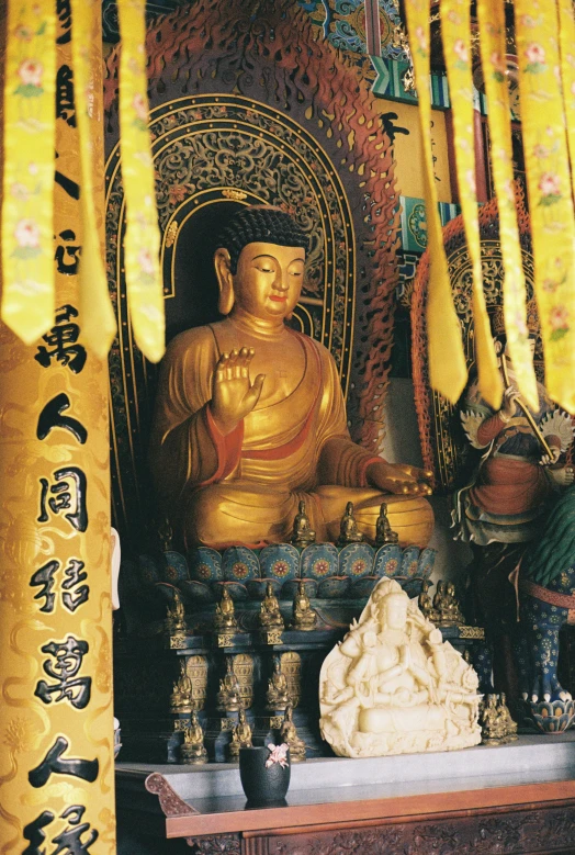 there is a buddha statue on display in this small room