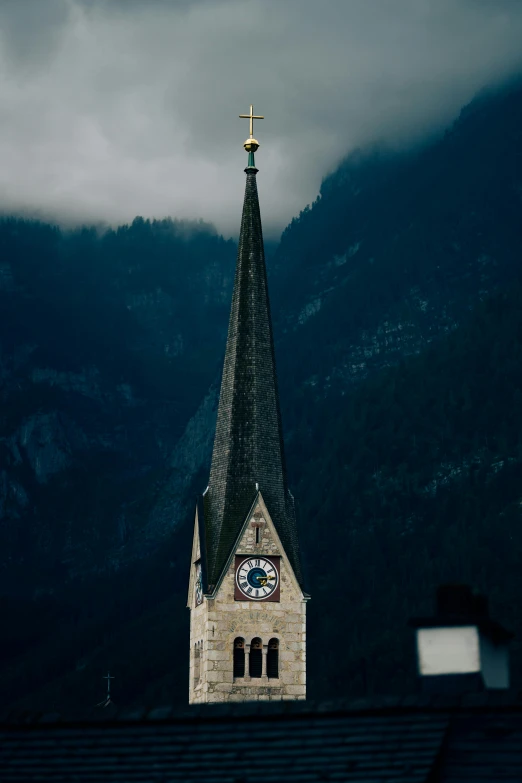 an old steeple on top of the building with a clock tower