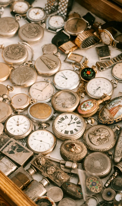 a collection of small and large watches and pocket watches