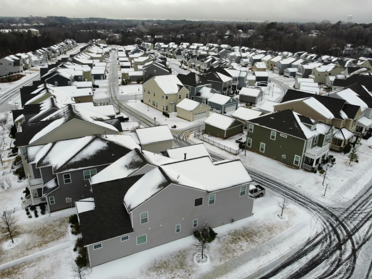 a group of houses in the suburbs during winter