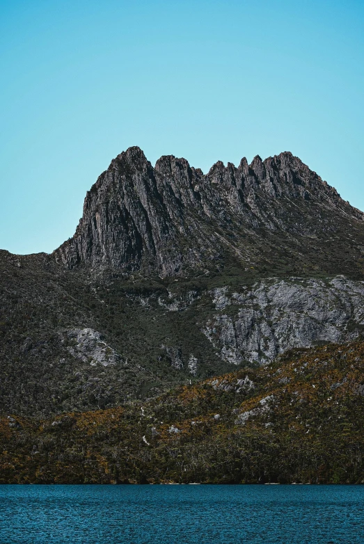 the big mountain range is shown on top of water