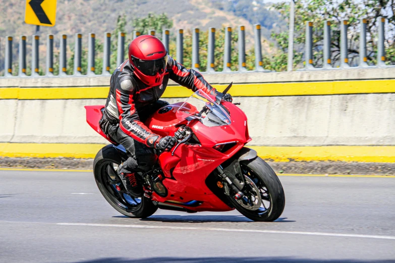 a motorcycle rider is going down the road