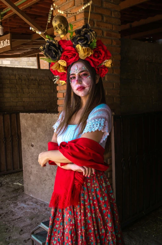 a woman with face makeup and a wreath of flowers