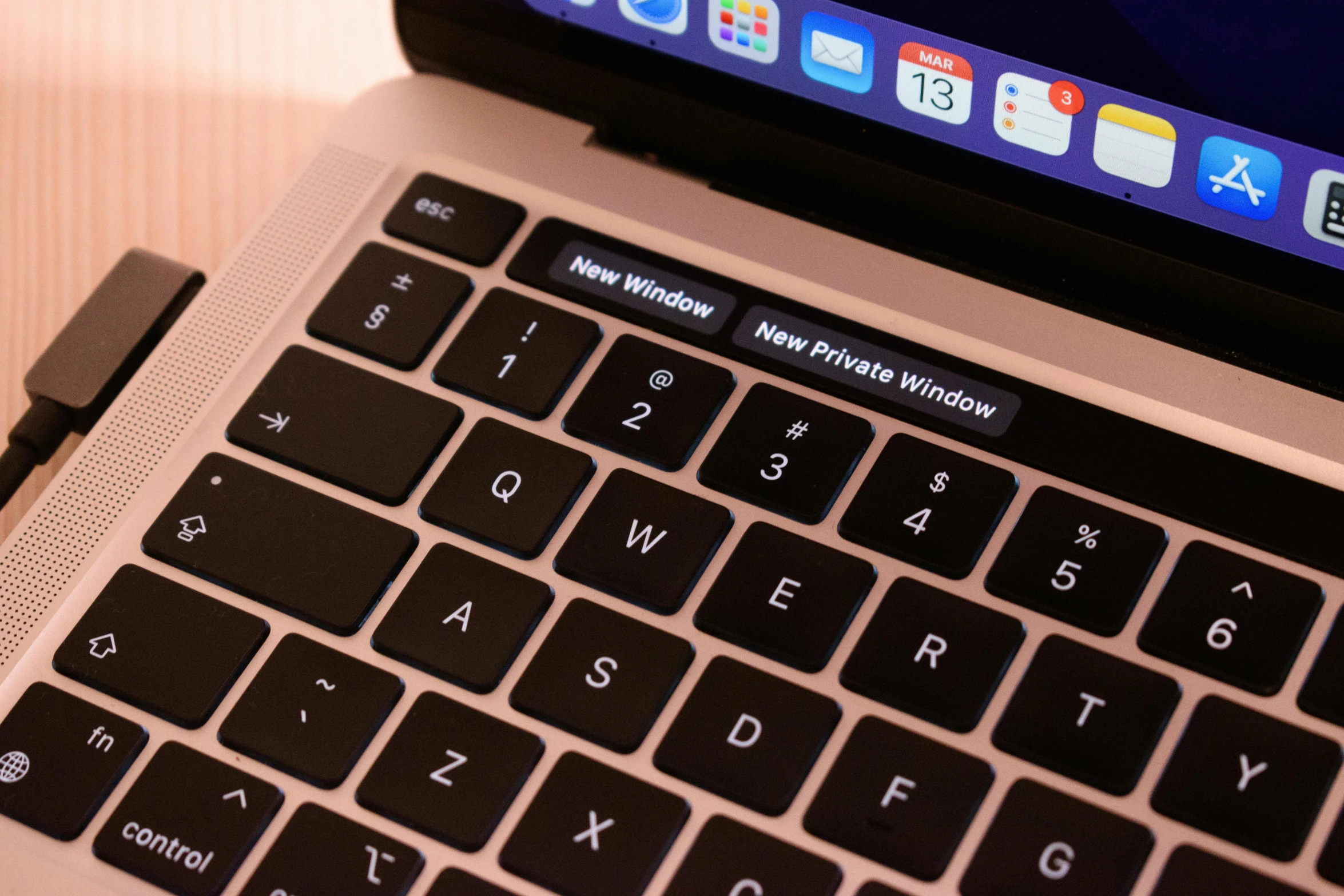 an apple macbook pro on its side has the keyboard cut out