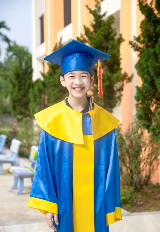 a  in graduation gown posing for a po