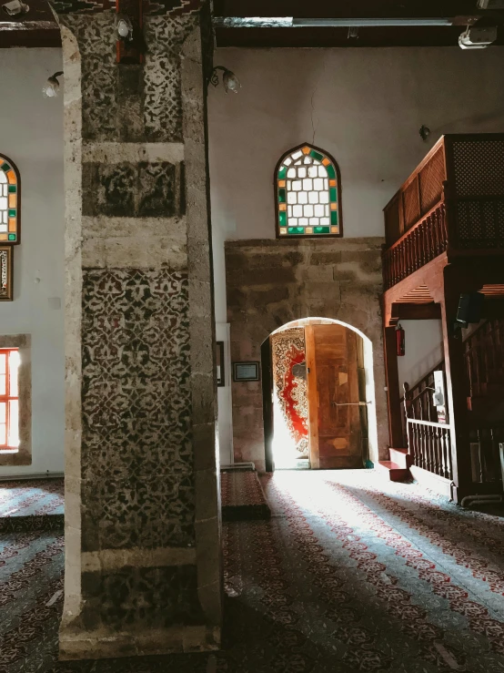 an empty building with stained glass windows