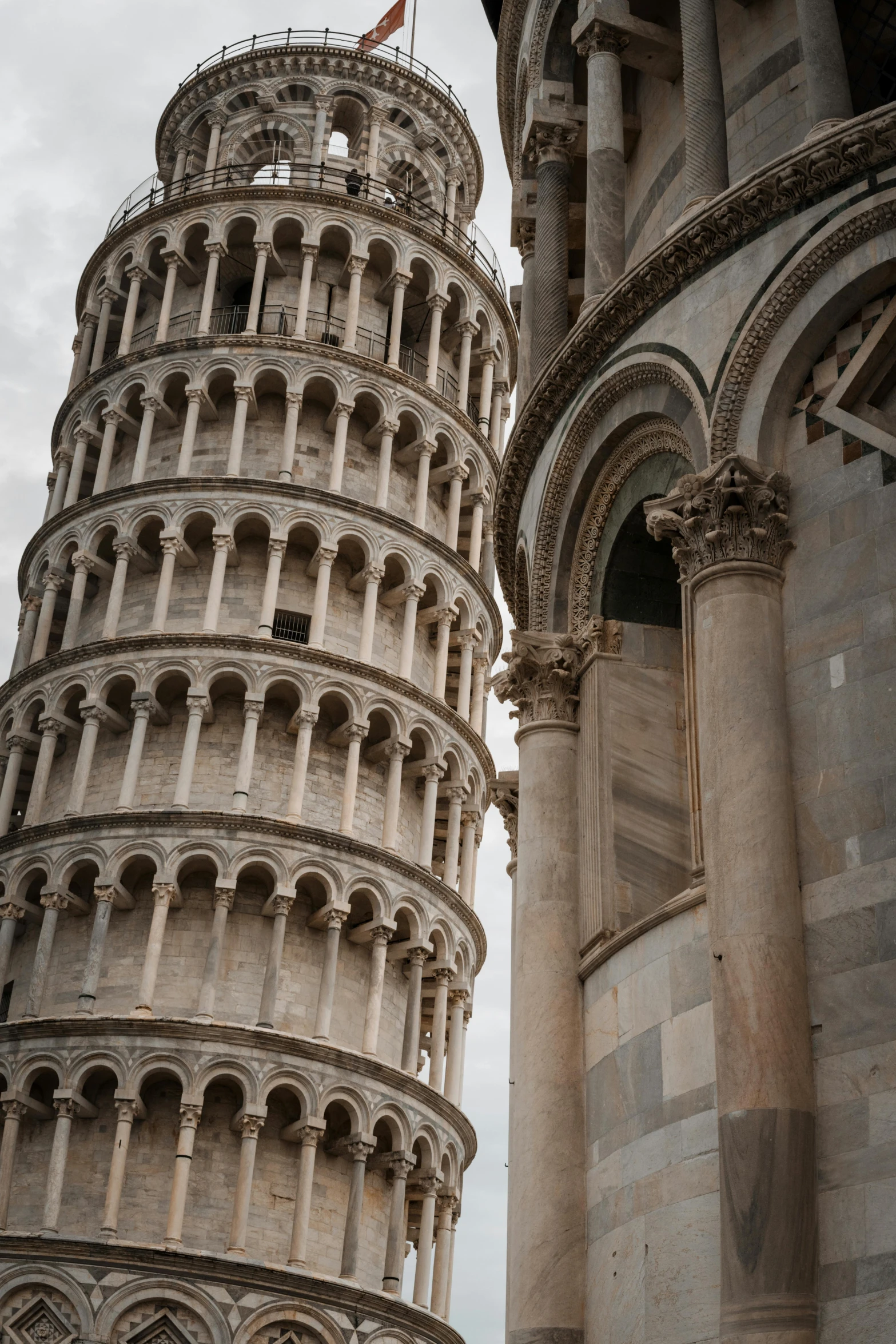 the leaning tower has many arches and small arches